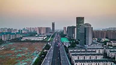 8K航拍南京江北新区龙华路车流延时摄影视频的预览图
